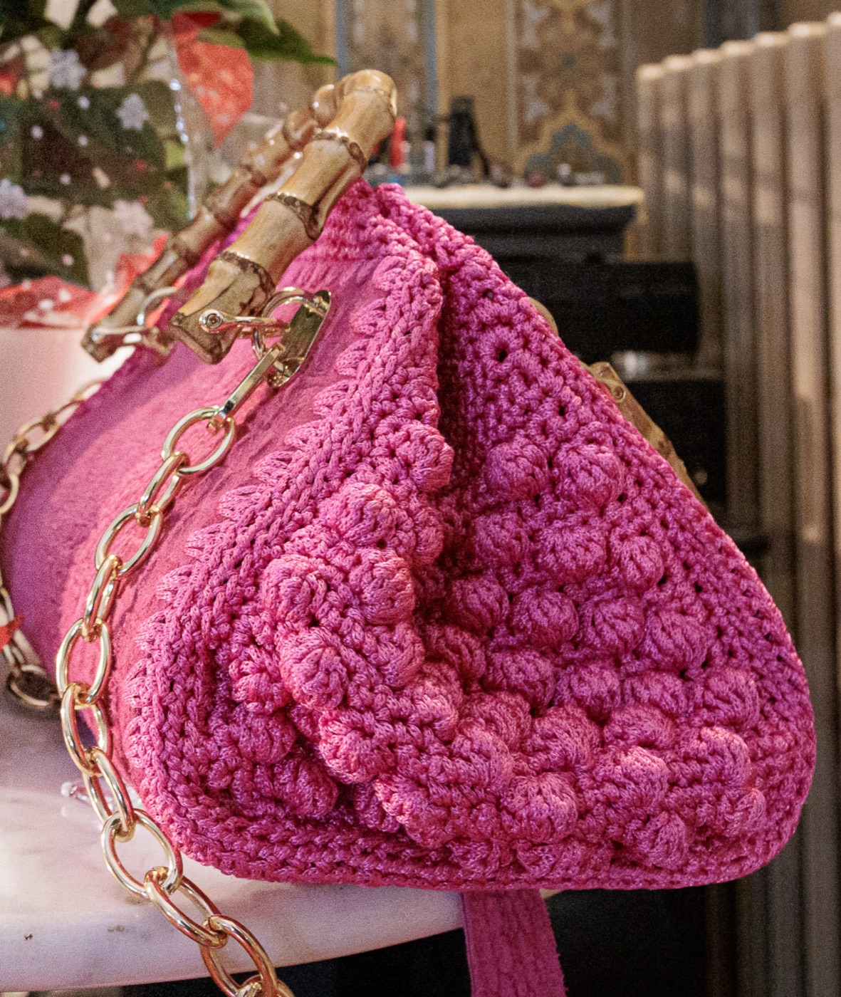 Pink hand-crocheted bag with bamboo clasp